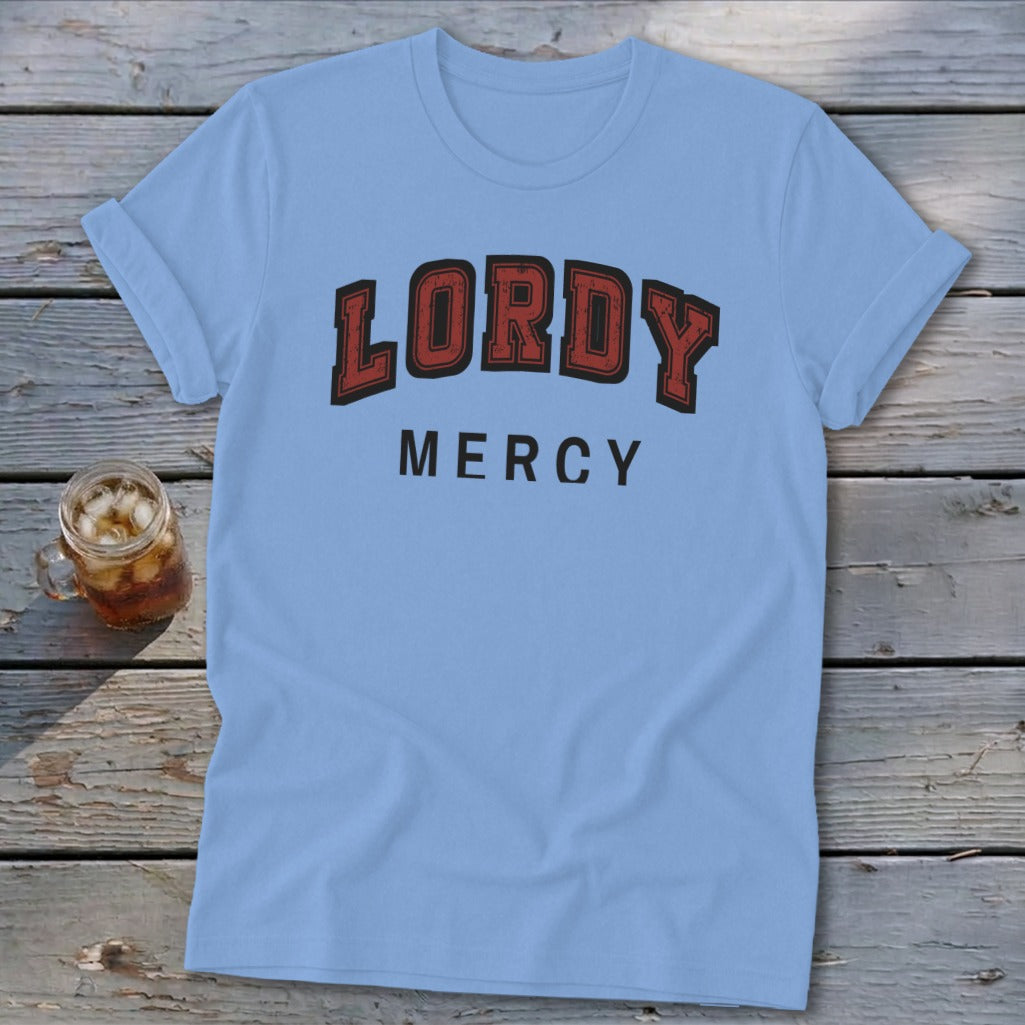 Light blue t-shirt with "LORDY MERCY" text on the front.
