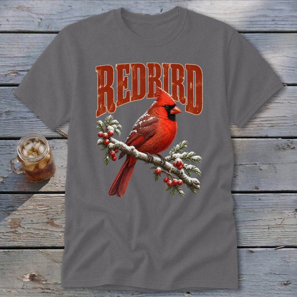 A dark gray t-shirt featuring a graphic of a red cardinal on a snowy branch with the text "REDBIRD".