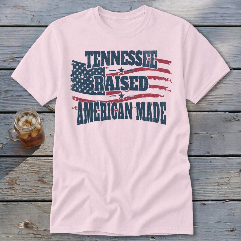Light pink t-shirt with distressed American flag graphic and text "Tennessee Raised American Made".