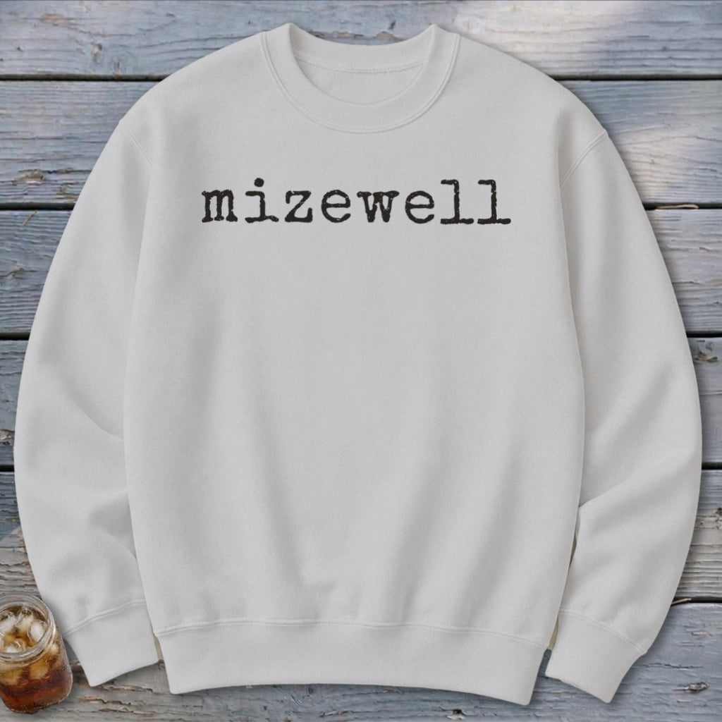 White sweatshirt with "mizewell" in black typewriter font.