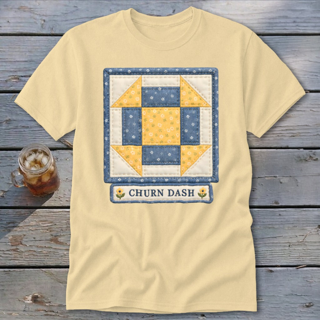 Pale yellow t-shirt with a "Churn Dash" quilt block design and text.