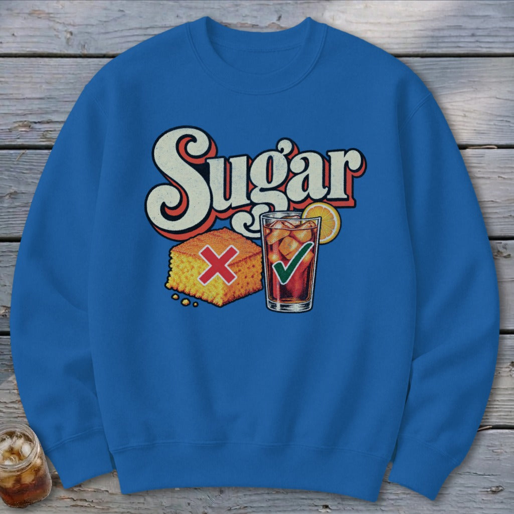 Blue crewneck sweatshirt featuring a graphic with the text Sugar, a cornbread piece with a red X, and a glass of iced tea with a green checkmark.
