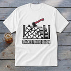 White t-shirt with black graphic of stacked firewood, an axe, and the text "STACKED FOR THE SEASON".