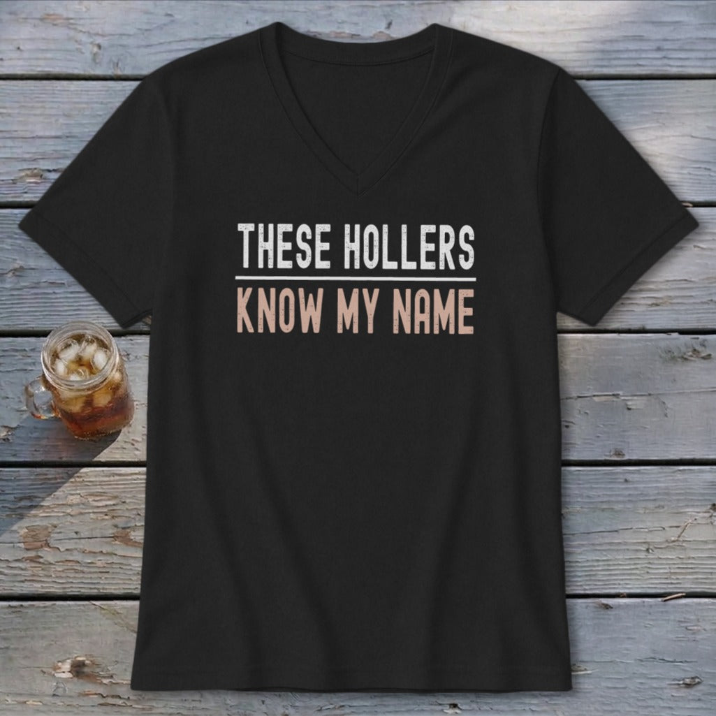 Black v-neck t-shirt with "THESE HOLLERS KNOW MY NAME" text.