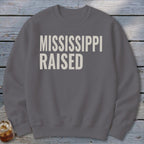 Gray sweatshirt with "MISSISSIPPI RAISED" in white, distressed lettering.