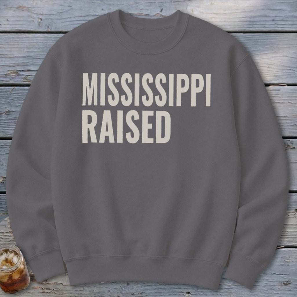 Gray sweatshirt with "MISSISSIPPI RAISED" in white, distressed lettering.