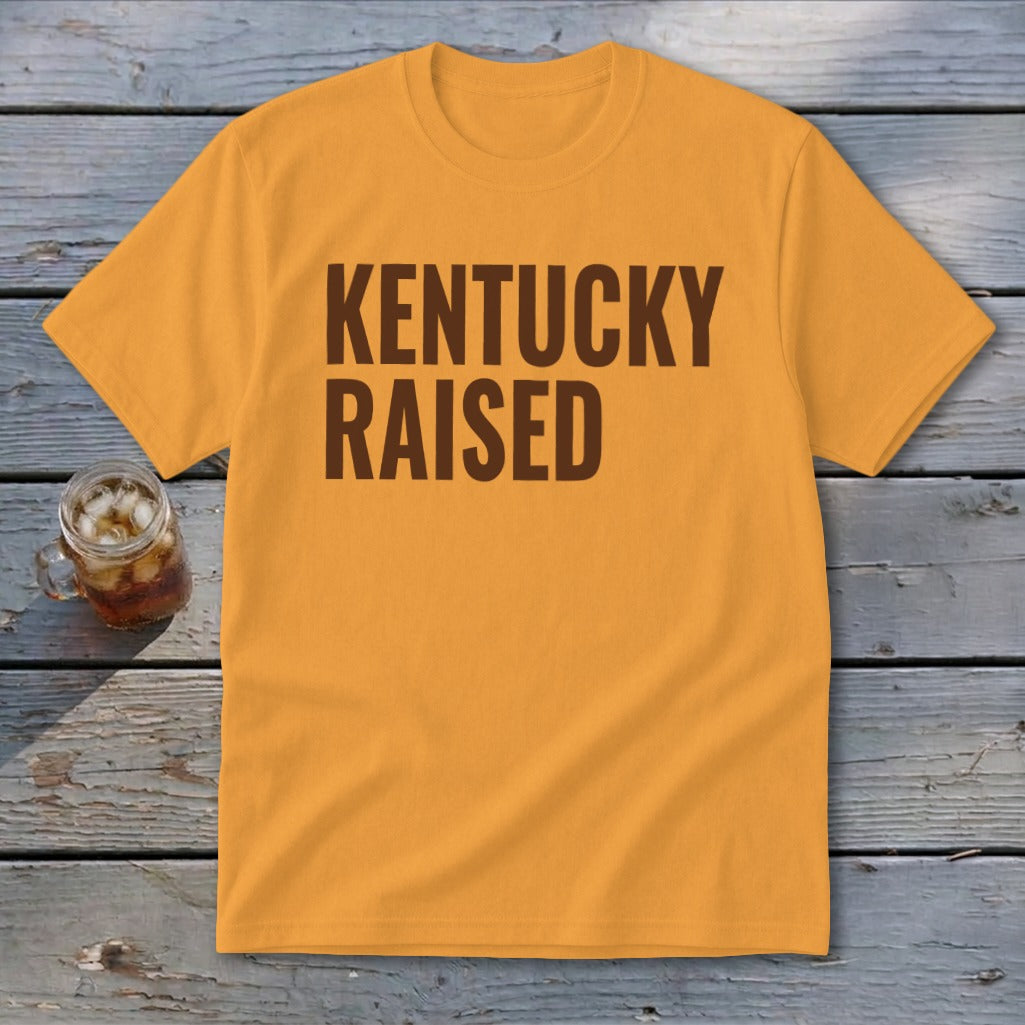 Orange t-shirt with "KENTUCKY RAISED" printed in brown text.