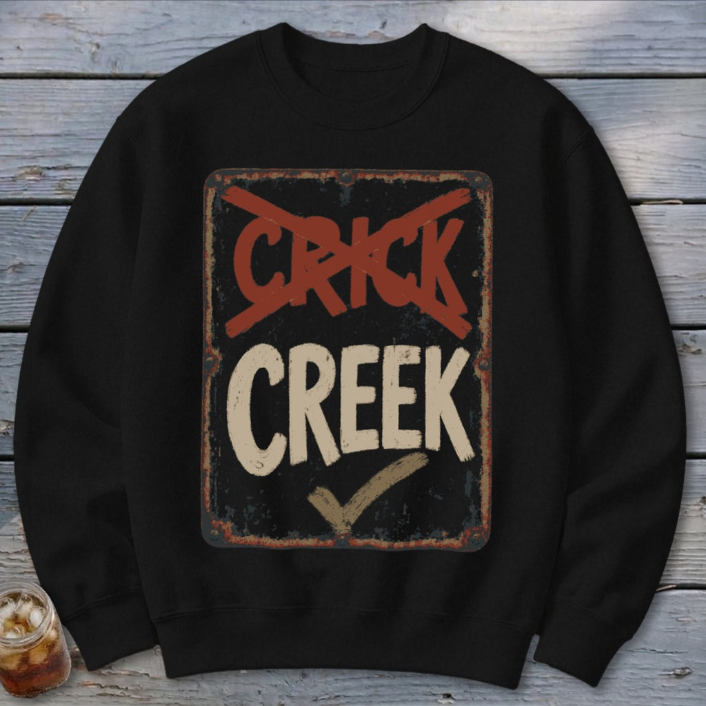 Black sweatshirt with distressed "CRICK CREEK" sign graphic, red cross-out, and checkmark.