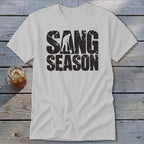 Light gray t-shirt with distressed black text reading SANG SEASON and a silhouette of a person digging.