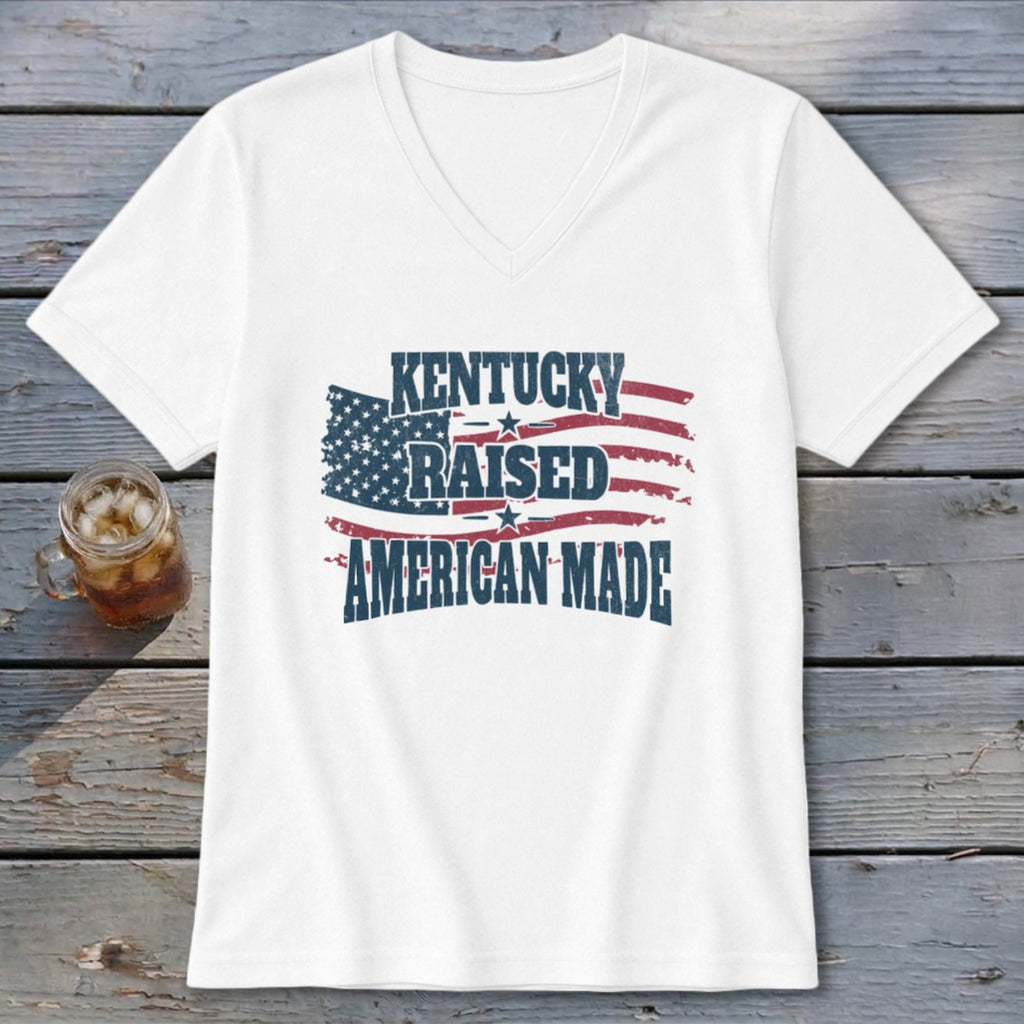 White v-neck t-shirt with "Kentucky Raised American Made" text and distressed American flag.