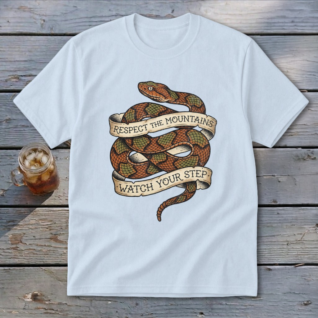 White t-shirt with coiled snake graphic and text "Respect the Mountains Watch Your Step".