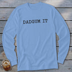Light blue long-sleeved shirt with "DADGUM IT" printed in black.