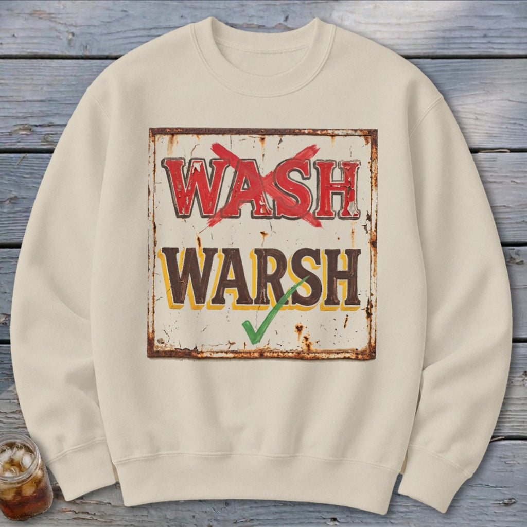 Beige crewneck sweatshirt featuring a graphic of a distressed sign with the text WASH with a red X and WARSH with a green checkmark.