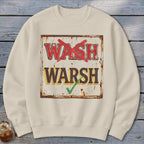 Beige crewneck sweatshirt featuring a graphic of a distressed sign with the text WASH with a red X and WARSH with a green checkmark.