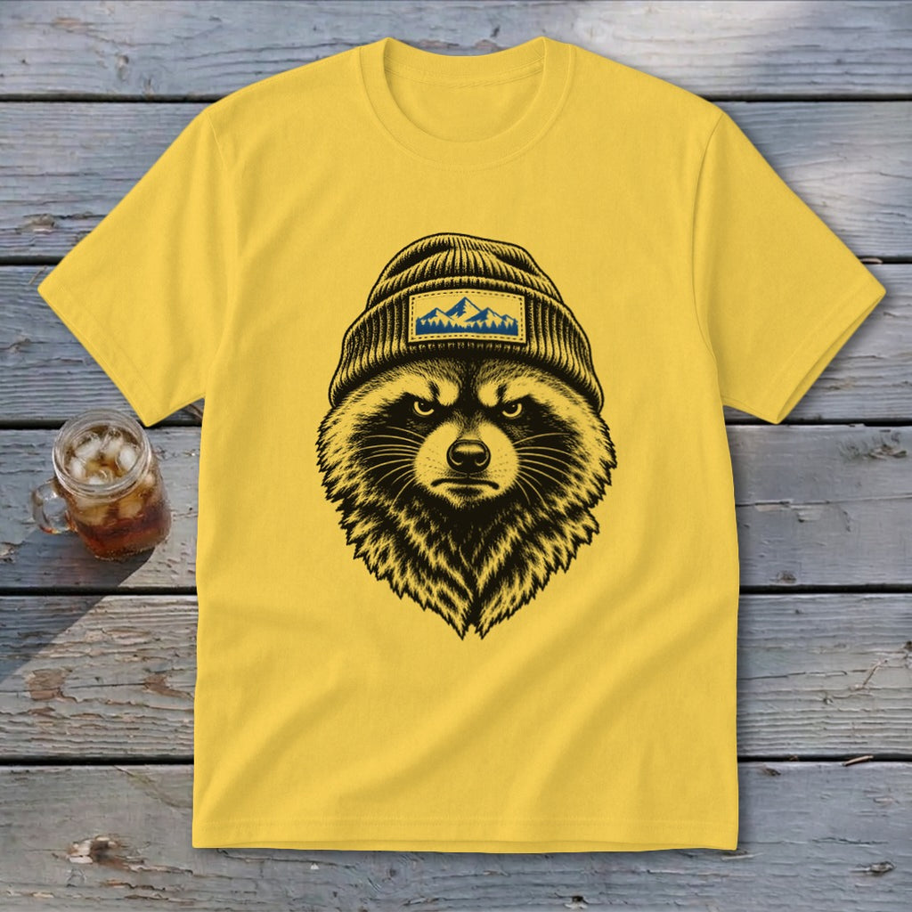 Yellow t-shirt with black and white illustration of a raccoon wearing a beanie with a mountain patch.