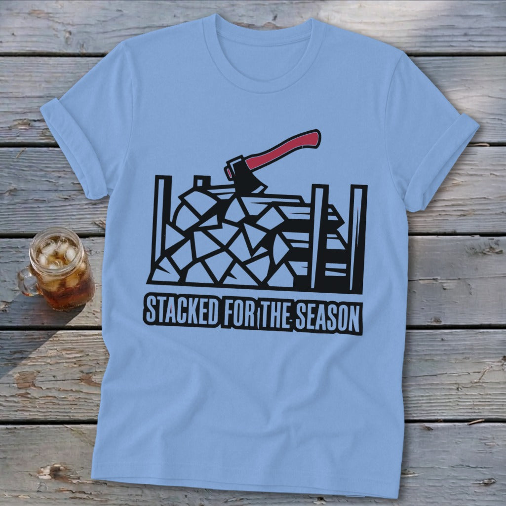 Light blue t-shirt with stacked firewood and axe graphic and text.