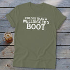 Olive green t-shirt with white text that reads "Colder Than A Welldigger's Boot".