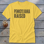 Yellow t-shirt with "PENNSYLVANIA RAISED" in black text.