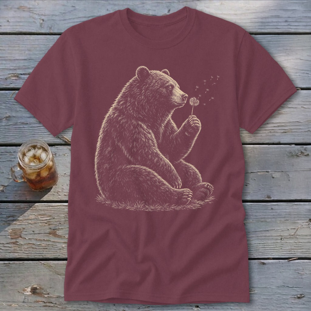 Maroon t-shirt with sketch of bear sitting and blowing on a dandelion