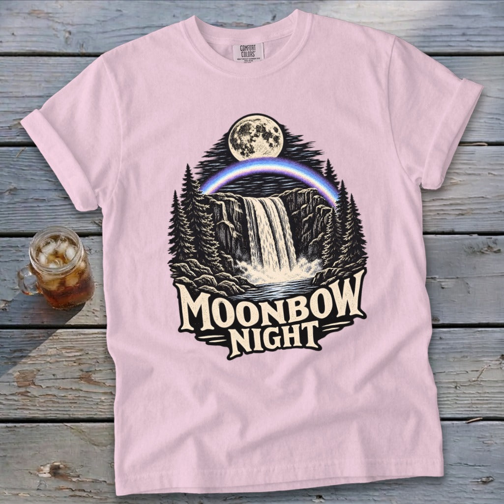 Pink t-shirt with "Moonbow Night" graphic of waterfall, moon, and rainbow.