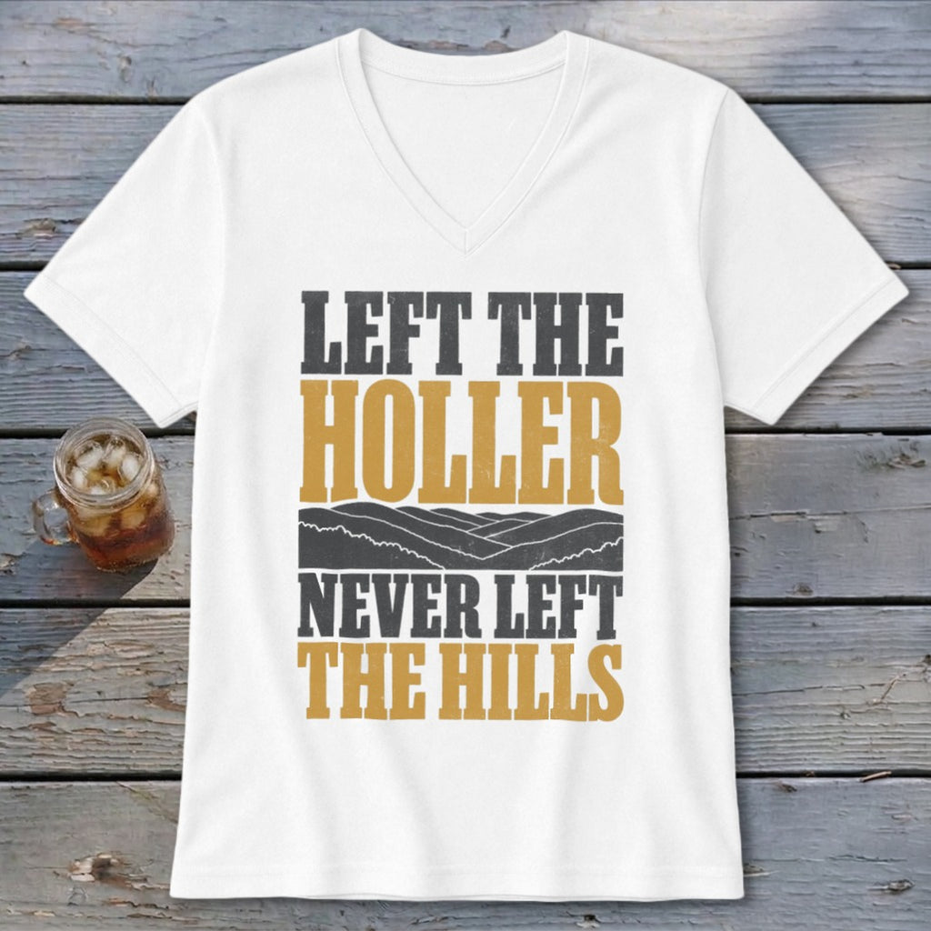 White v-neck shirt with "LEFT THE HOLLER NEVER LEFT THE HILLS" text and mountain graphic.