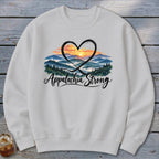 White sweatshirt with "Appalachia Strong" text over a mountain landscape and heart design.