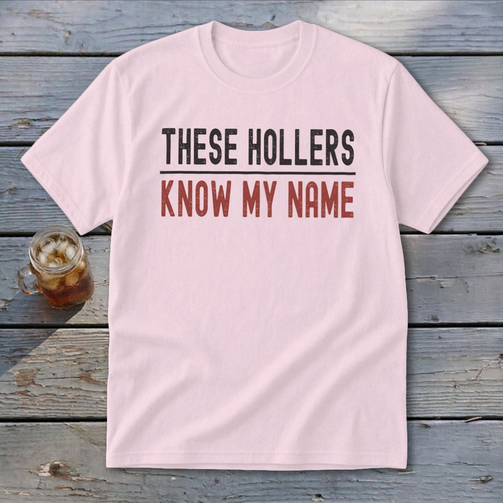 Light pink t-shirt with text "THESE HOLLERS KNOW MY NAME"
