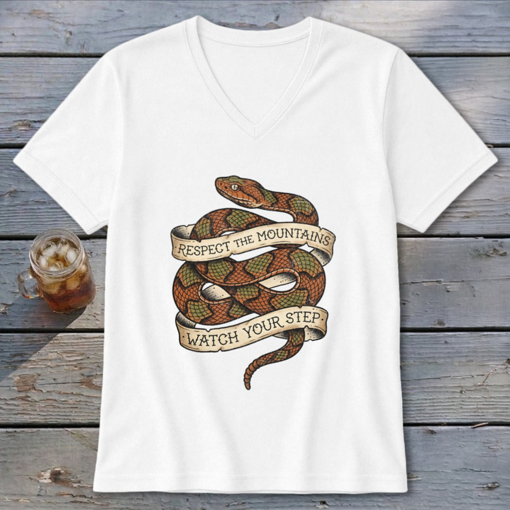 White v-neck t-shirt with coiled snake graphic and text: "RESPECT THE MOUNTAINS WATCH YOUR STEP."