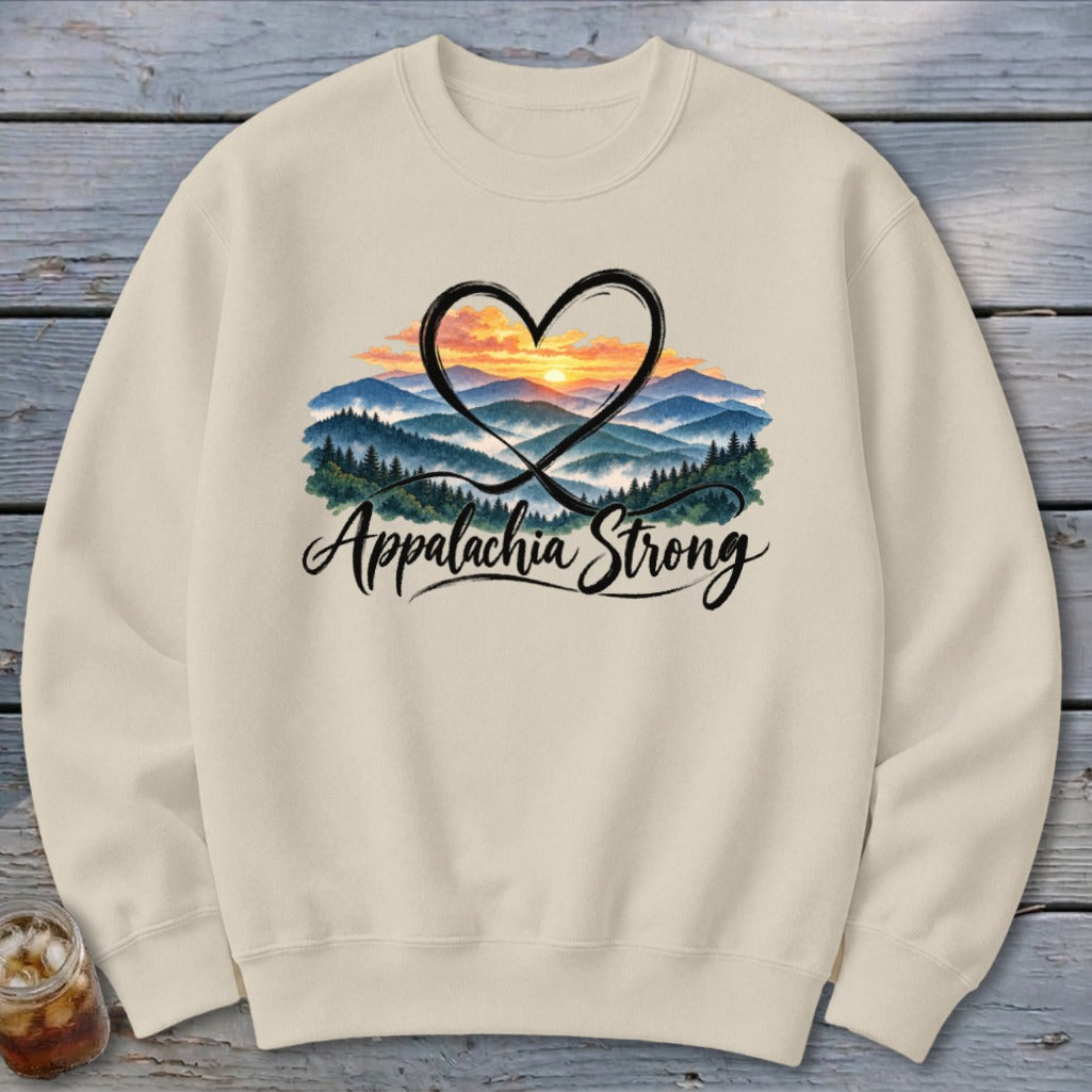 Cream sweatshirt with "Appalachia Strong" and a heart over mountains at sunset.