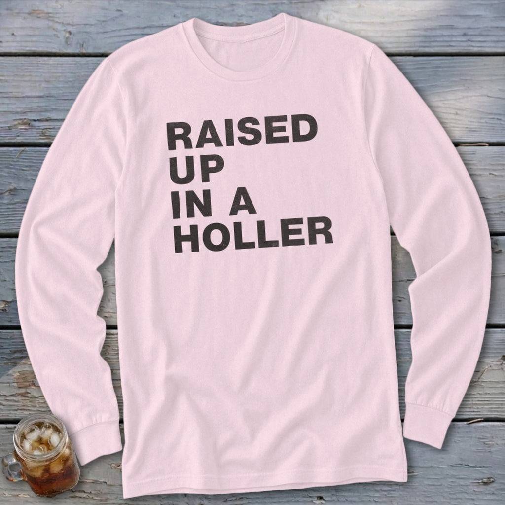 Pink long-sleeve shirt with "RAISED UP IN A HOLLER" text in black.