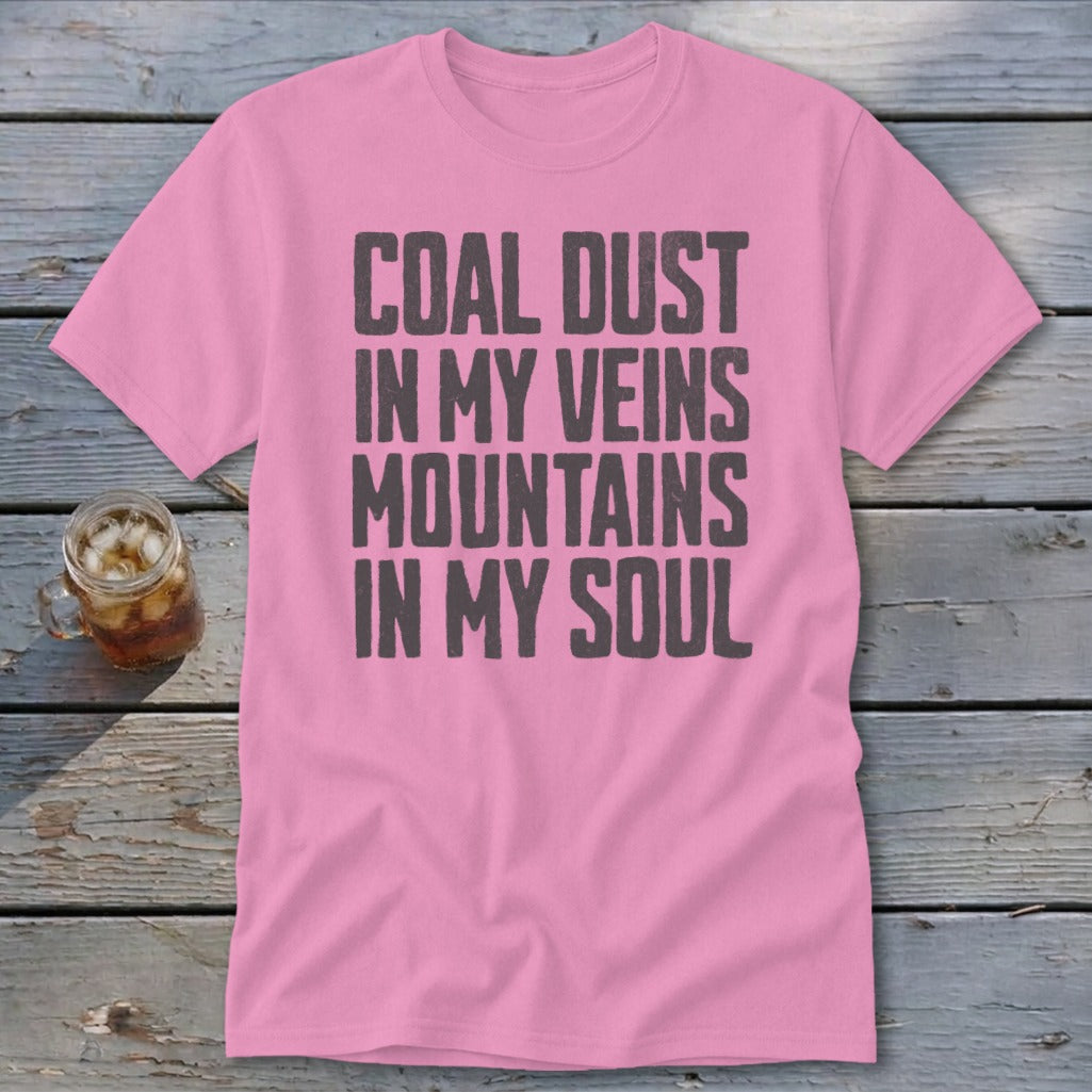 A pink t-shirt with the black text COAL DUST IN MY VEINS MOUNTAINS IN MY SOUL.