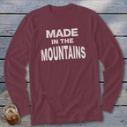 Maroon long-sleeve shirt with white text that reads "MADE IN THE MOUNTAINS".