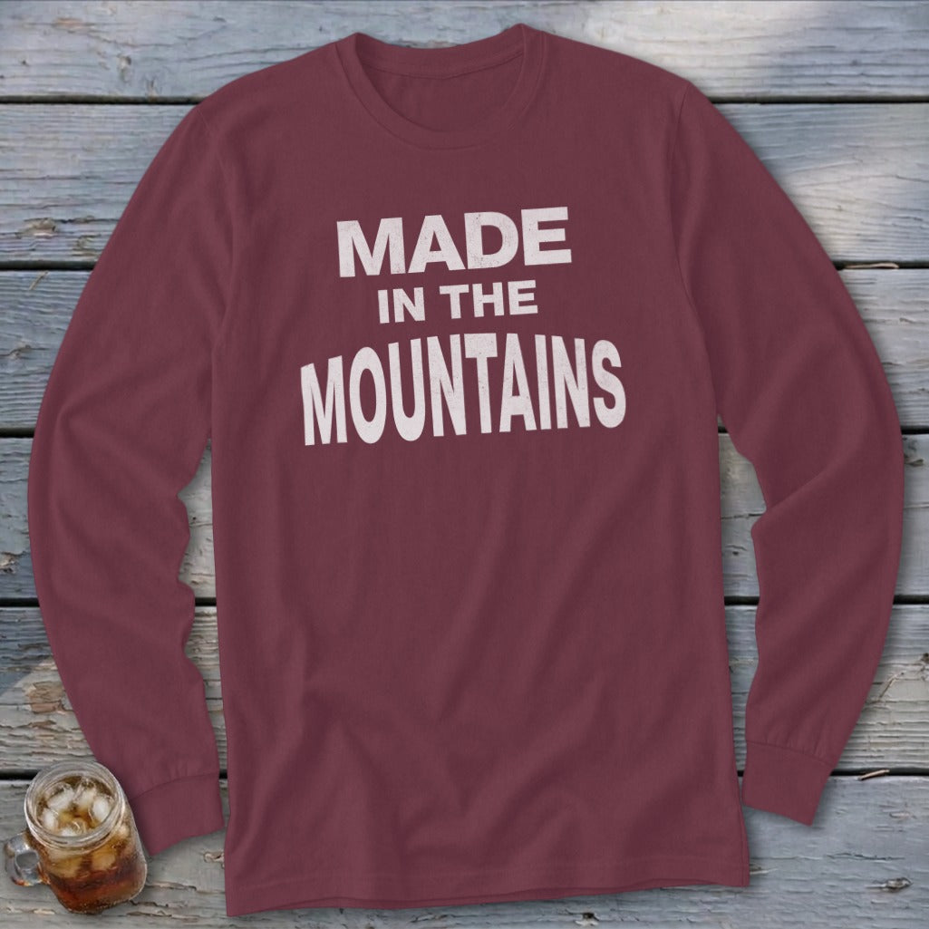 Maroon long-sleeve shirt with white text that reads "MADE IN THE MOUNTAINS".
