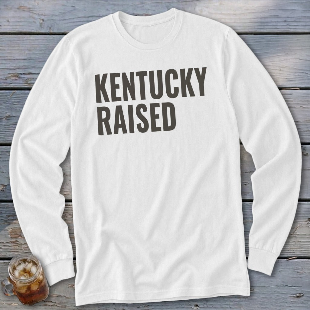 White long-sleeved shirt with "Kentucky Raised" printed in dark gray text.