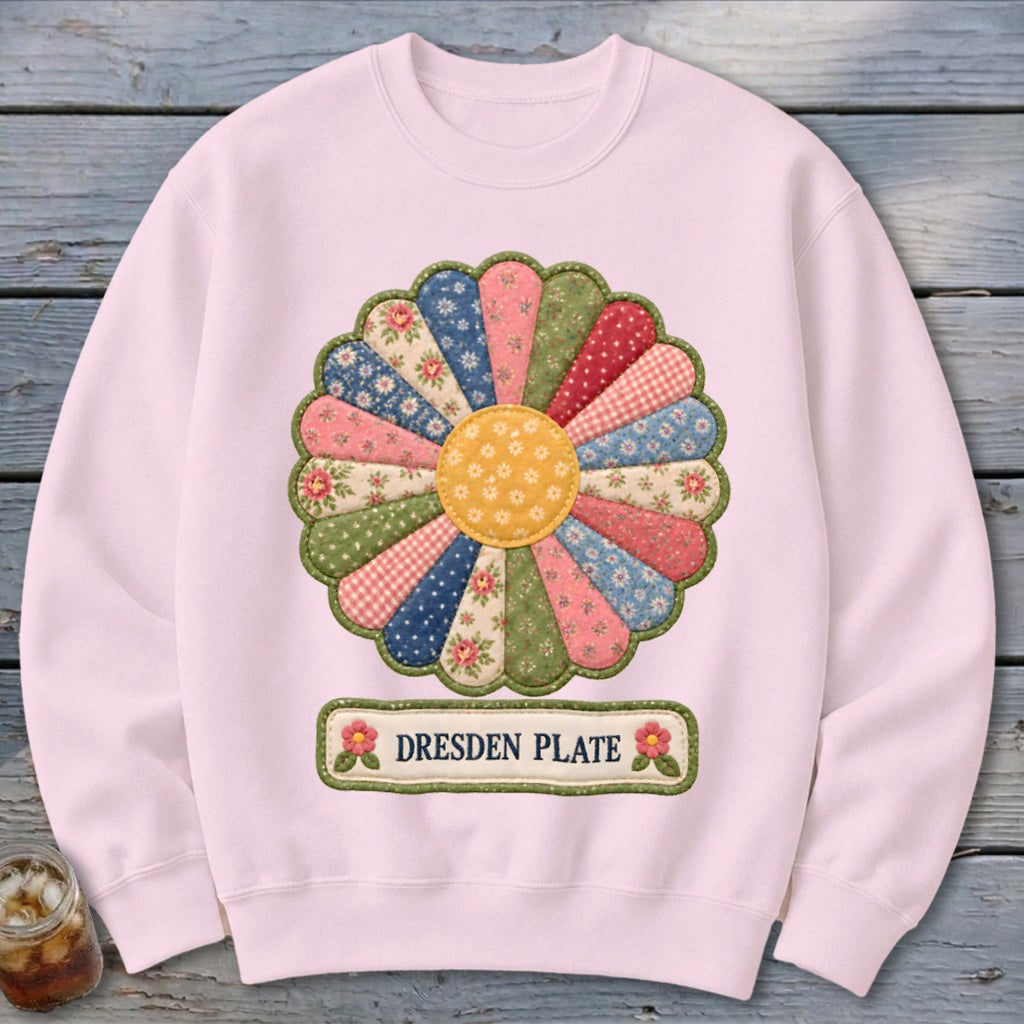 Pink sweatshirt featuring a Dresden Plate floral applique and text.