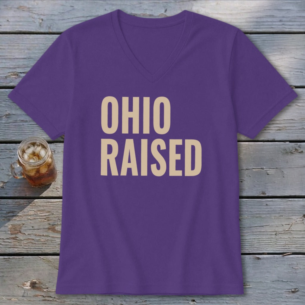 Purple v-neck t-shirt with tan text reading "OHIO RAISED".
