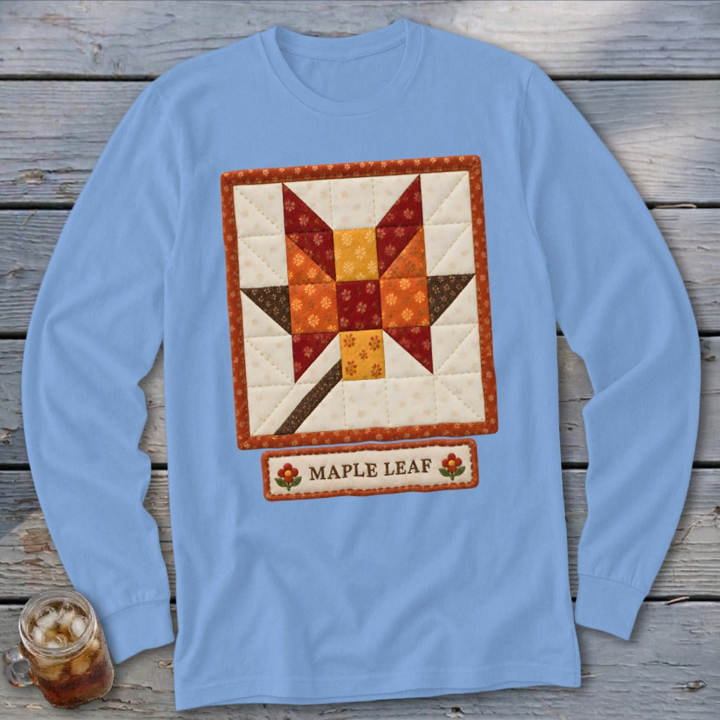 Light blue long-sleeve shirt with a quilted maple leaf design and the words "MAPLE LEAF."