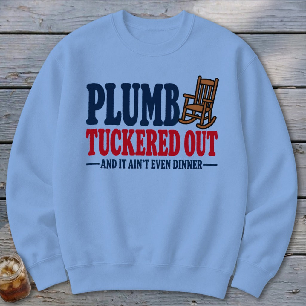 Light blue sweatshirt with text "Plumb Tuckered Out - And It Ain't Even Dinner".