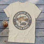 Cream t-shirt with circular graphic of a jumping trout and text "Mountain Born River Bred".