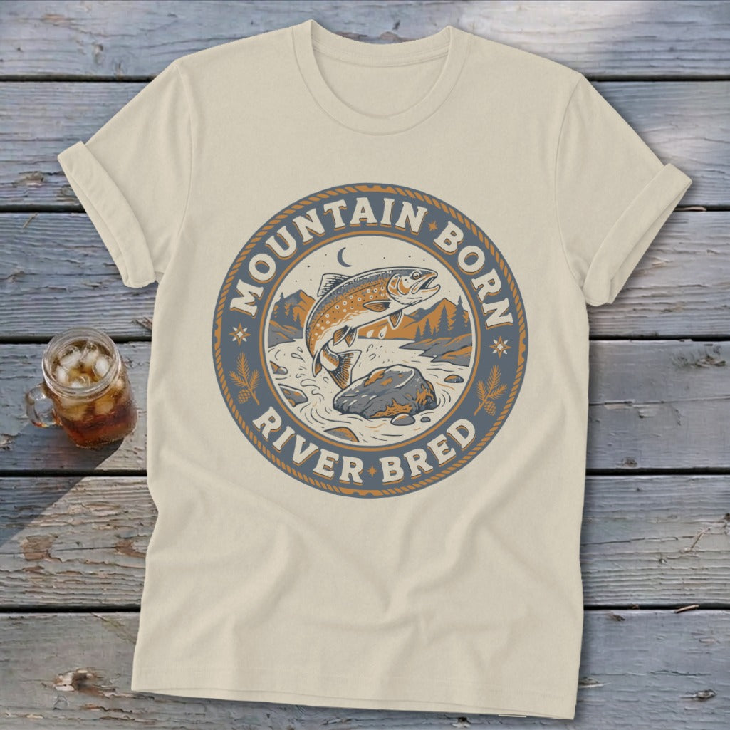 Cream t-shirt with circular graphic of a jumping trout and text "Mountain Born River Bred".
