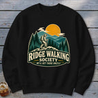 Black sweatshirt with Ridge Walking Society graphic and hiking scene.
