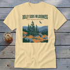 Light yellow t-shirt featuring a green graphic of Dolly Sods Wilderness with pine trees and a flying bird.