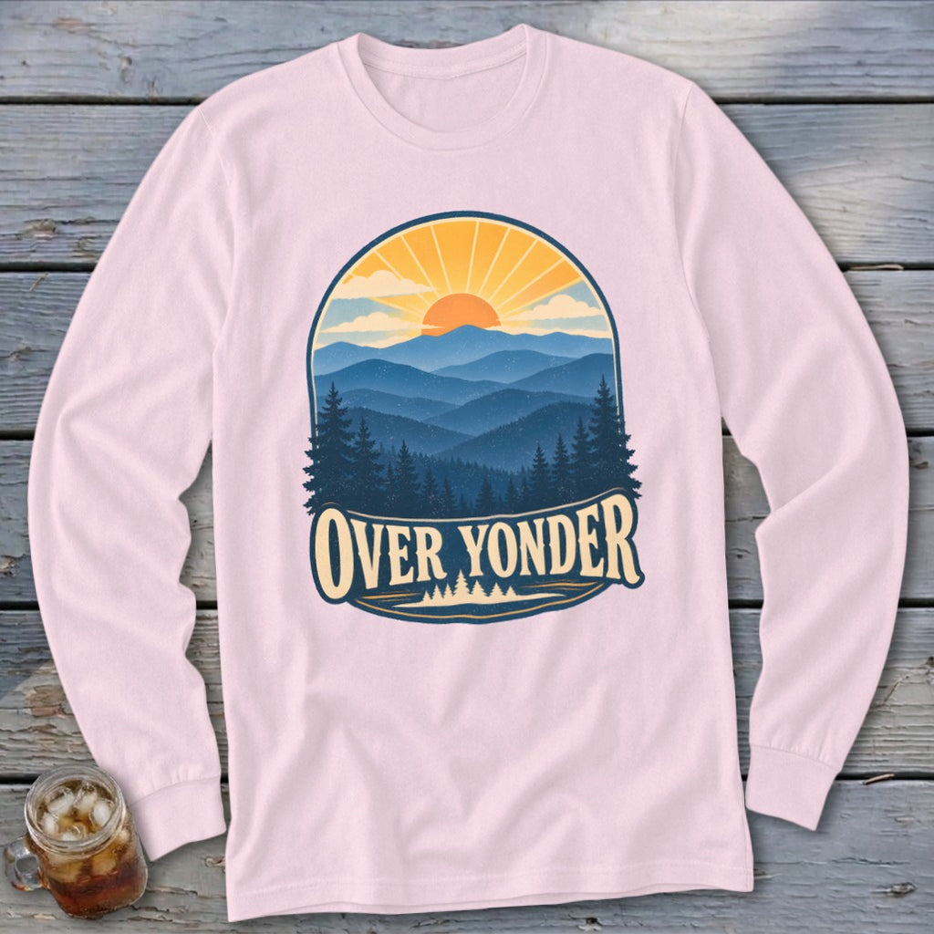 Light pink long-sleeve t-shirt featuring a retro mountain landscape graphic with the text Over Yonder.