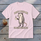 Pink t-shirt with opossum holding coffee, text "Don't Mind Me I'm Just Sulled Up".