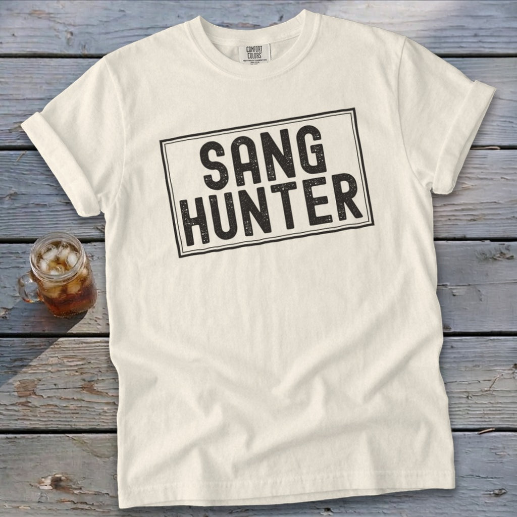 Cream t-shirt with black text "SANG HUNTER" in a rectangular frame.