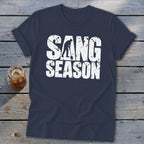 Dark blue t-shirt featuring white distressed text reading SANG SEASON with a silhouette digging.