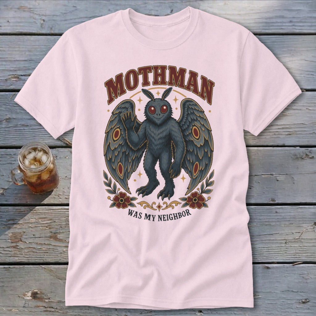 Pink t-shirt with Mothman artwork: "MOTHMAN WAS MY NEIGHBOR".