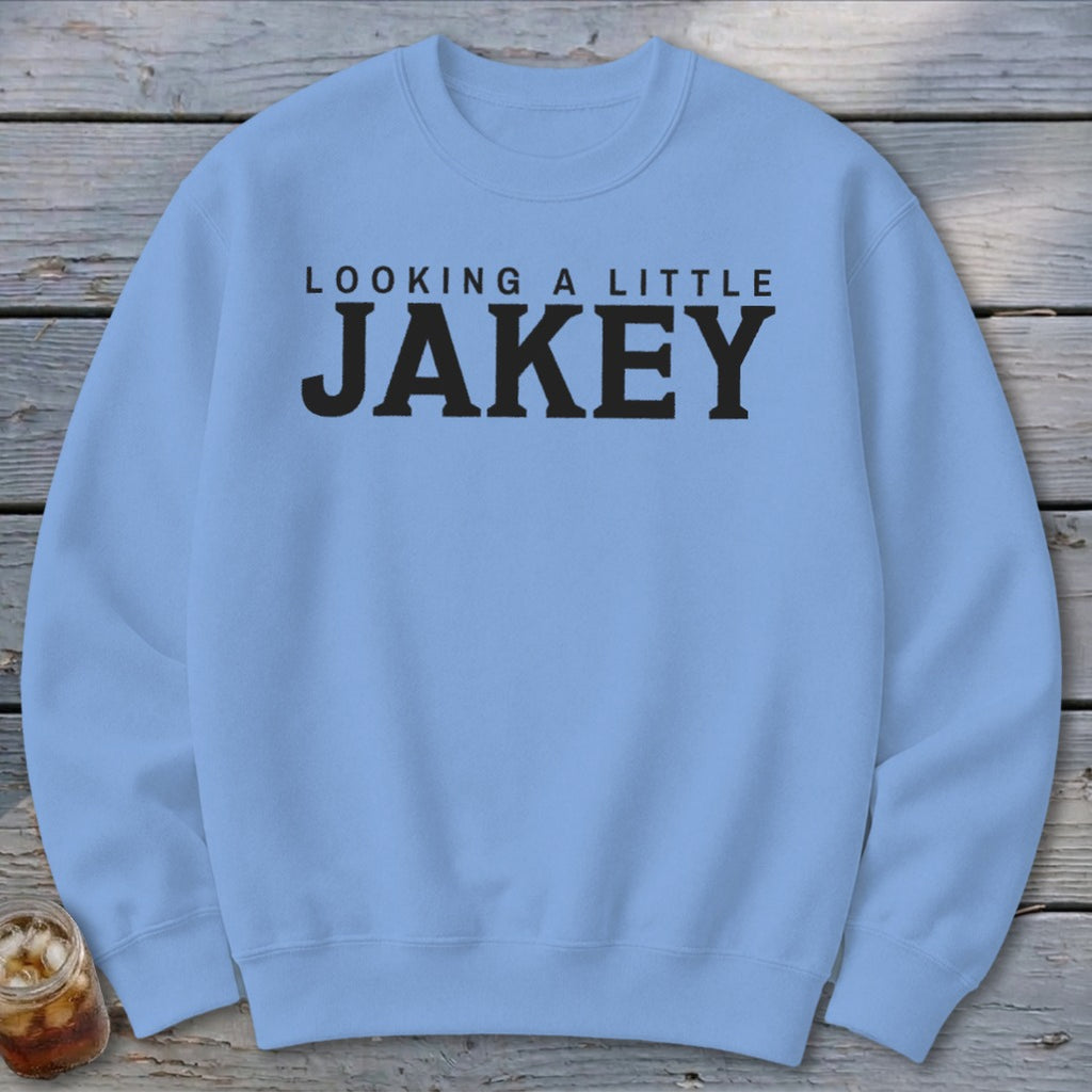 Light blue sweatshirt with black text reading "LOOKING A LITTLE JAKEY".