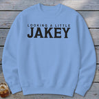 Light blue sweatshirt with black text reading "LOOKING A LITTLE JAKEY".