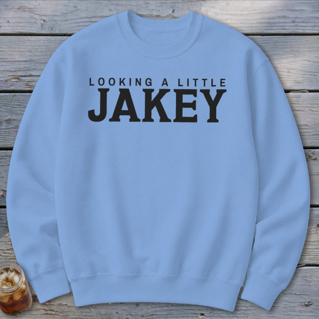Light blue sweatshirt with black text reading "LOOKING A LITTLE JAKEY".